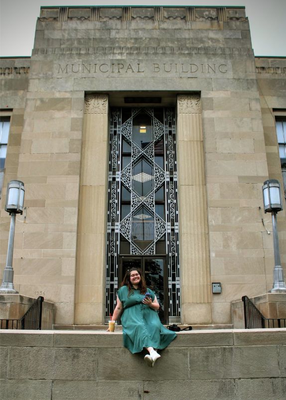 Rebecca sitting at the Kenmore Municipal Building